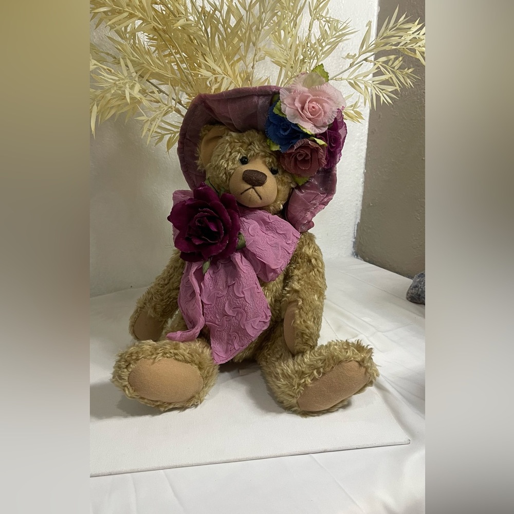 This cute little bear with flower around aaa decoration not new. One size brown.